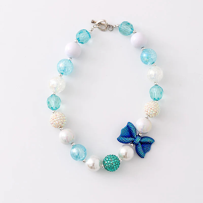 The LRW Accessory Edit (blue bow necklace)