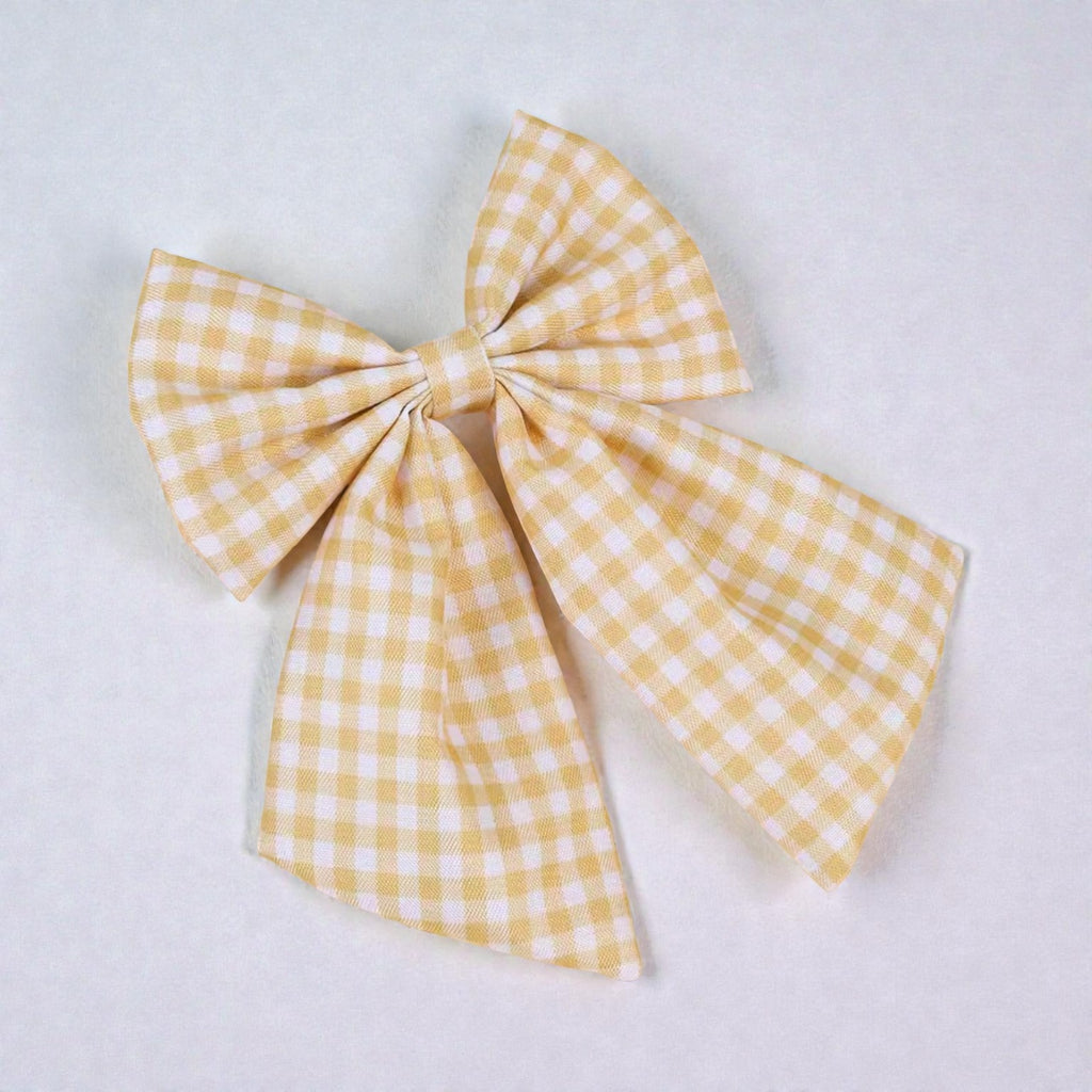 The LRW Hair Accessory Edit (muted yellow gingham bow)